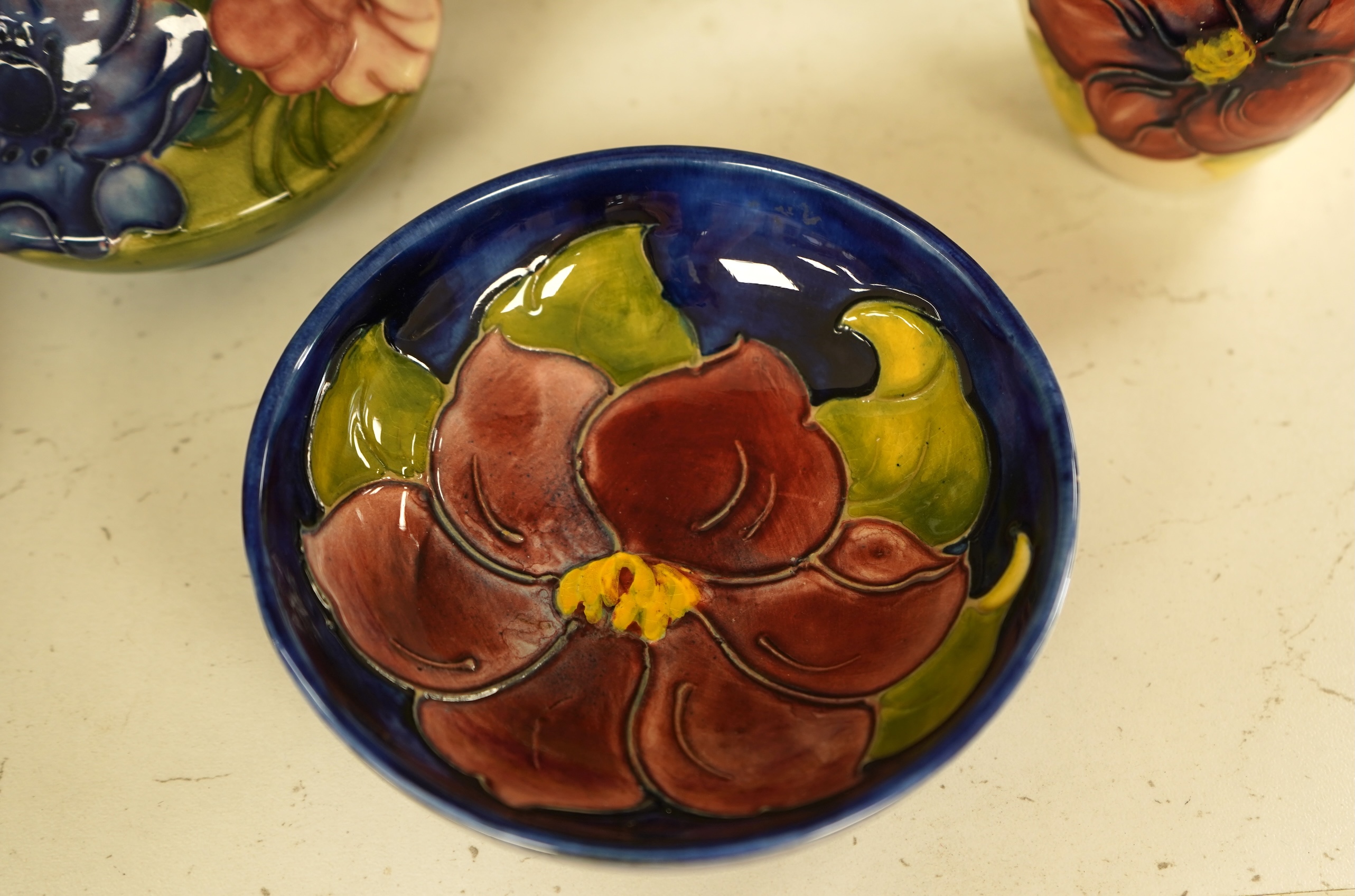 A collection of nine modern Moorcroft pieces including a Furzy Hill vase and a Toadstool vase, tallest 19cm